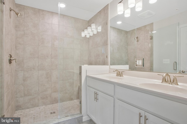 bathroom featuring vanity and walk in shower