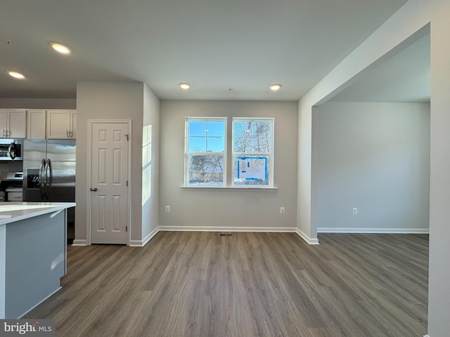 kitchen featuring white cabinetry, light hardwood / wood-style floors, and appliances with stainless steel finishes