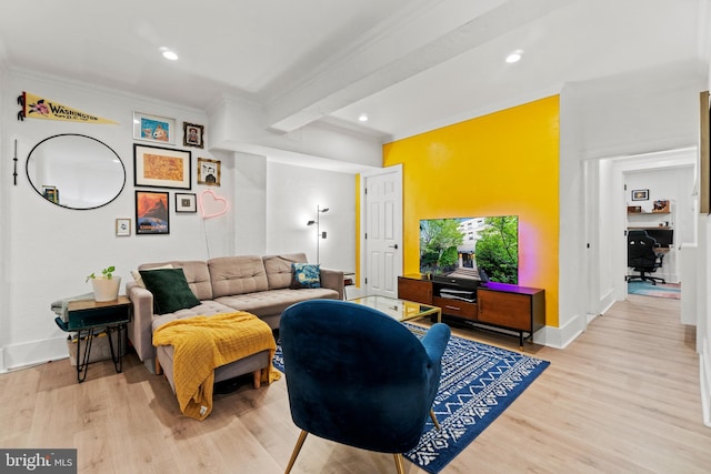 living room with beam ceiling and light hardwood / wood-style flooring