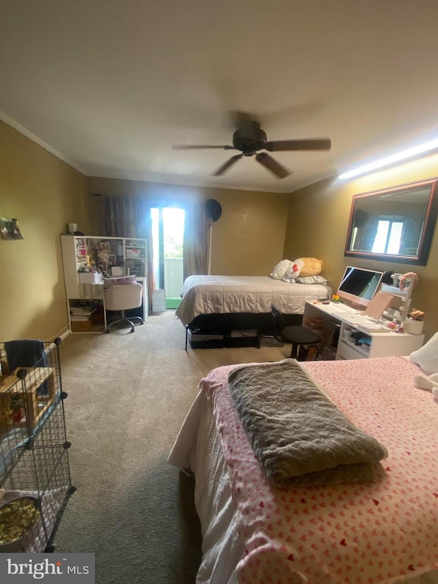 carpeted bedroom with ceiling fan and crown molding