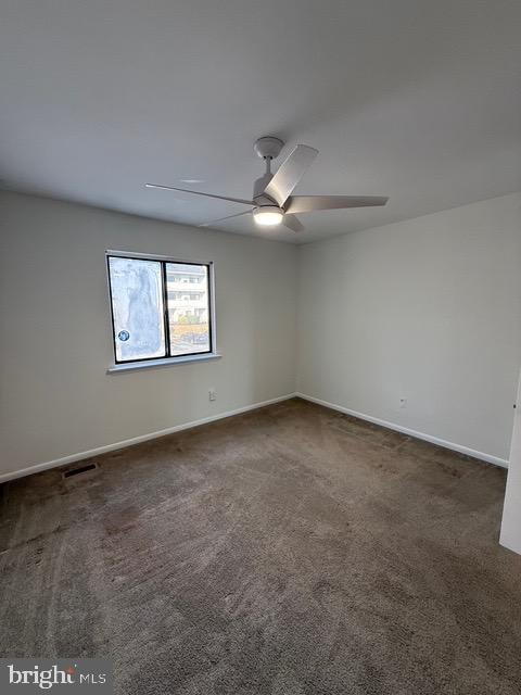 carpeted empty room with ceiling fan