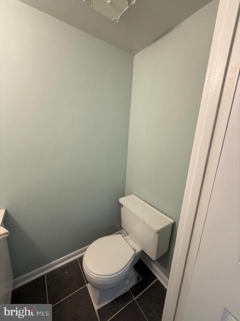 bathroom featuring tile patterned floors and toilet