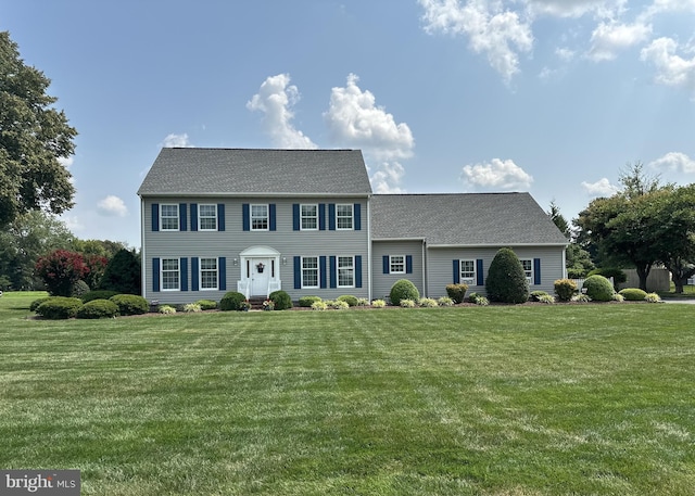 colonial home with a front yard