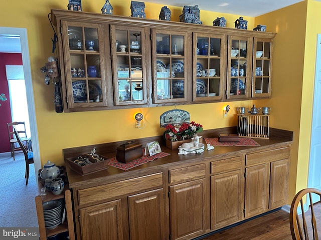 kitchen with dark hardwood / wood-style flooring