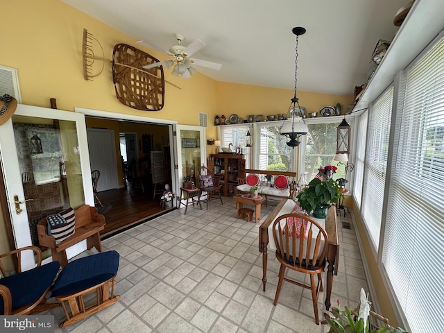 sunroom / solarium featuring lofted ceiling and ceiling fan