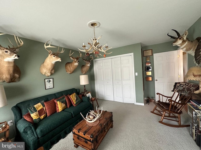 carpeted living room with a notable chandelier