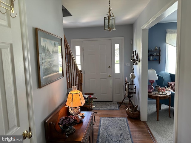 foyer entrance featuring hardwood / wood-style floors