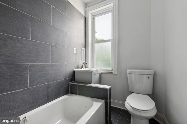 bathroom featuring toilet and tile patterned floors