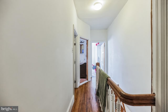 corridor with dark wood-type flooring