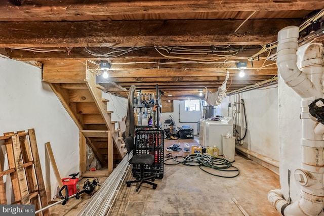 basement with washing machine and clothes dryer