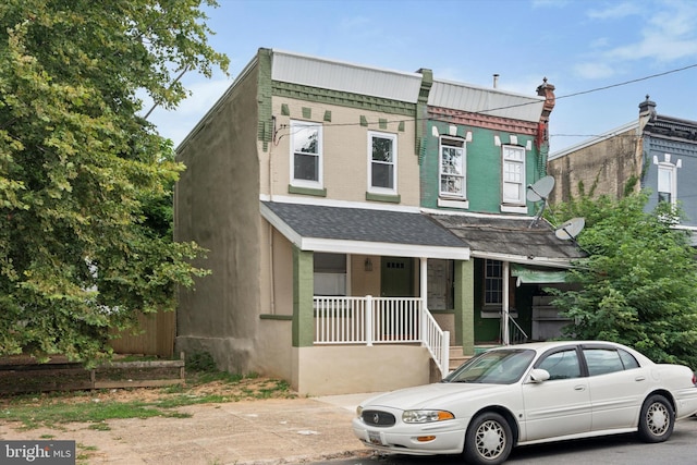 townhome / multi-family property with covered porch