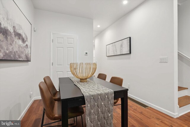 dining space featuring wood-type flooring