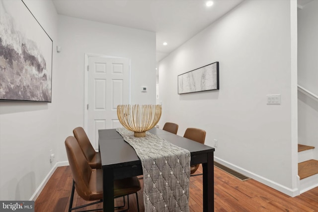 dining room with wood-type flooring