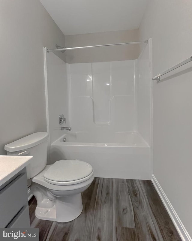 bathroom with vanity, wood-type flooring, and toilet