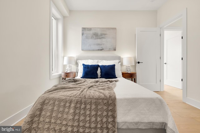 bedroom with light wood-type flooring