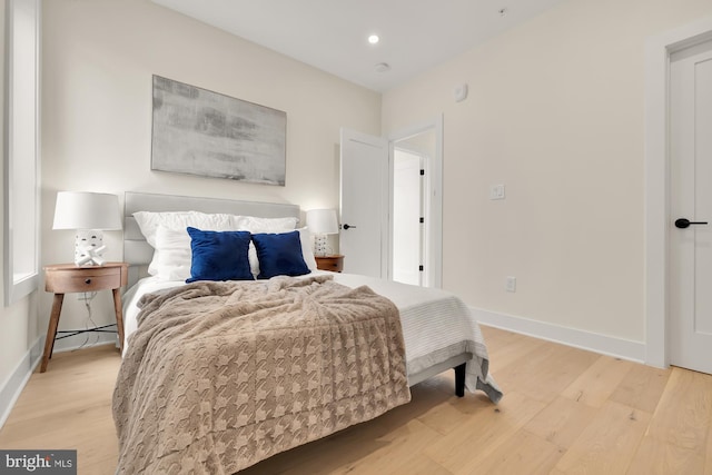 bedroom with light hardwood / wood-style flooring