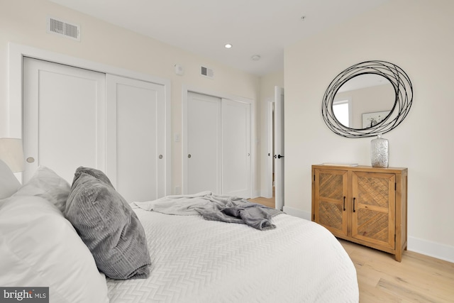 bedroom with light hardwood / wood-style floors