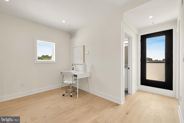 unfurnished office featuring light hardwood / wood-style flooring