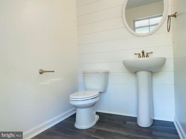 bathroom featuring toilet and hardwood / wood-style floors