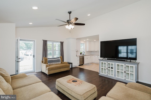 living room featuring a ceiling fan, wood finished floors, baseboards, recessed lighting, and vaulted ceiling