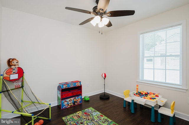 rec room featuring dark wood-type flooring and ceiling fan