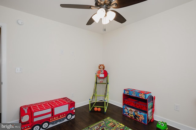 playroom with wood finished floors, baseboards, and ceiling fan