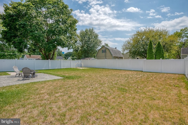 view of yard with a patio area and a fenced backyard