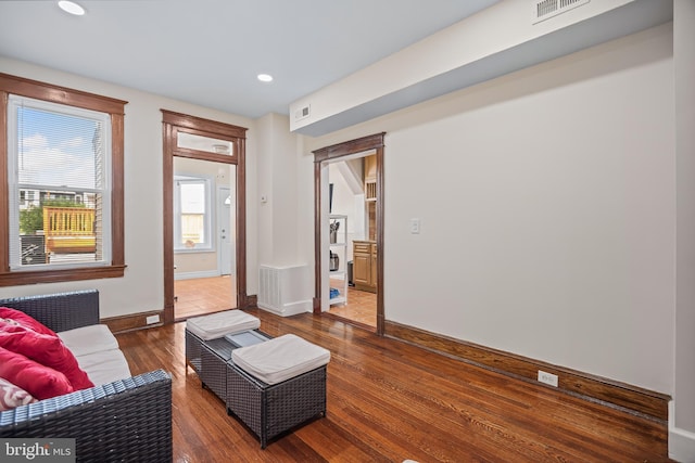 living room featuring dark wood-type flooring