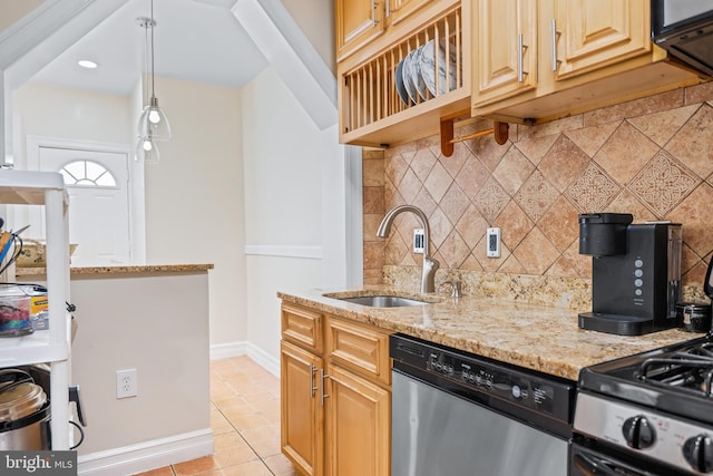 kitchen featuring light tile patterned flooring, sink, light stone counters, dishwasher, and decorative backsplash