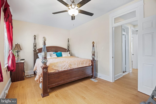 bedroom with light wood-type flooring and ceiling fan