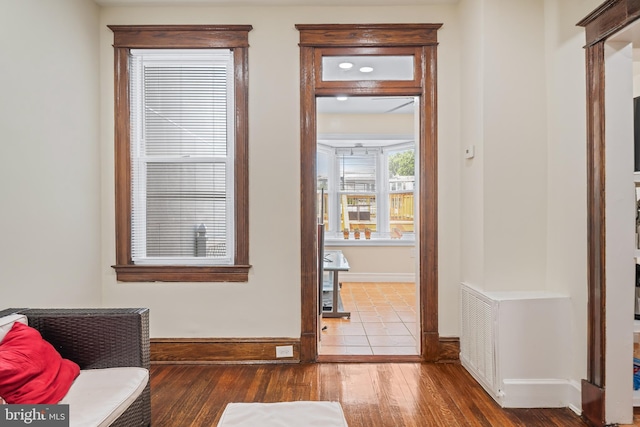 doorway with hardwood / wood-style floors