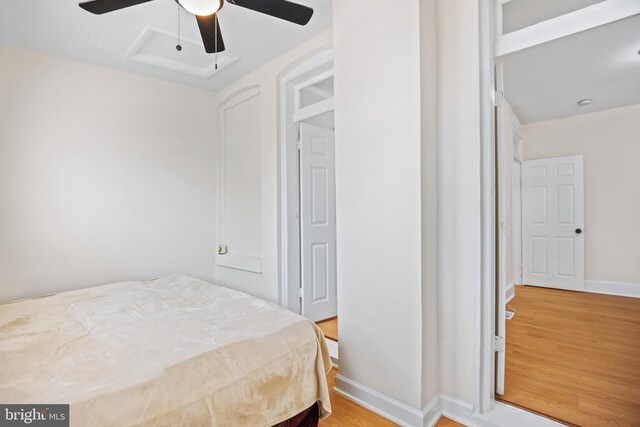 bedroom with ceiling fan and light wood-type flooring