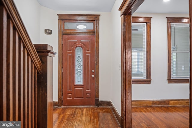 entrance foyer with dark hardwood / wood-style flooring