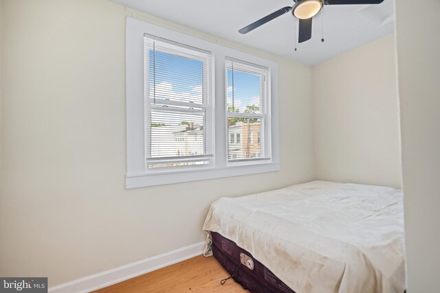 bedroom featuring ceiling fan and light hardwood / wood-style floors