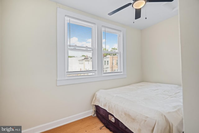 bedroom featuring wood-type flooring and ceiling fan