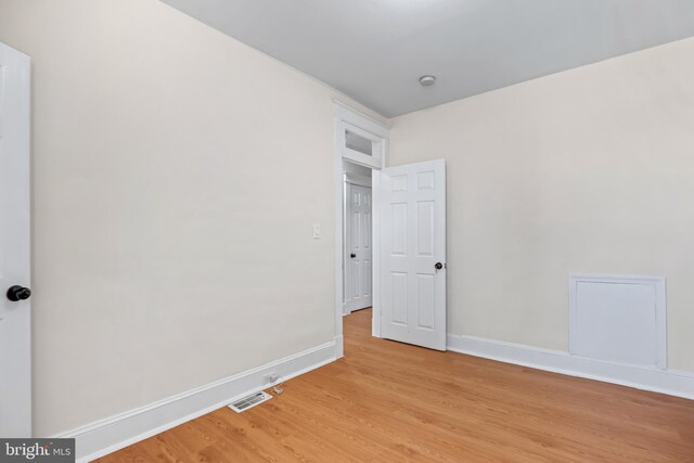 empty room with light wood-type flooring