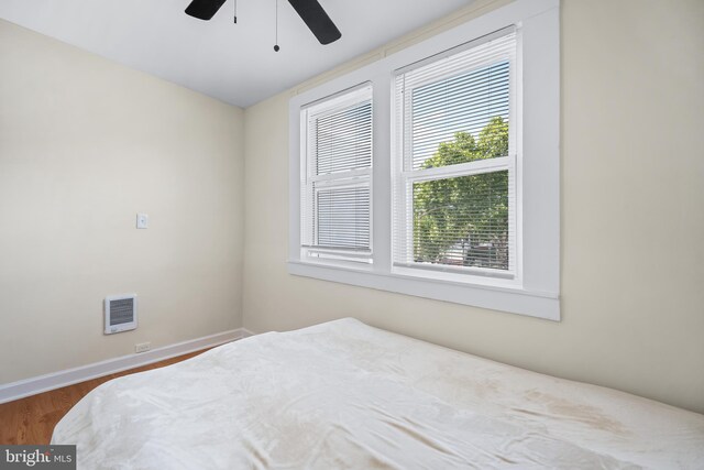 bedroom featuring hardwood / wood-style floors and ceiling fan