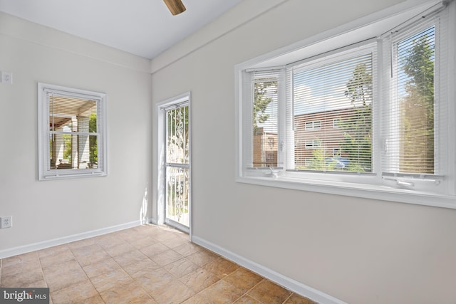 spare room featuring ceiling fan