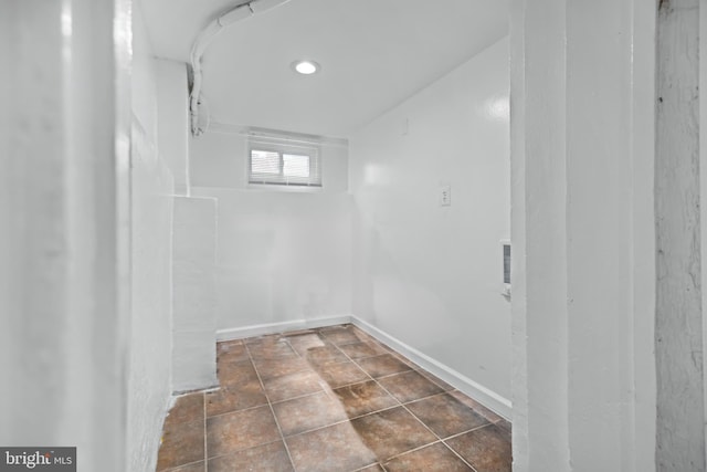 interior space with dark tile patterned flooring