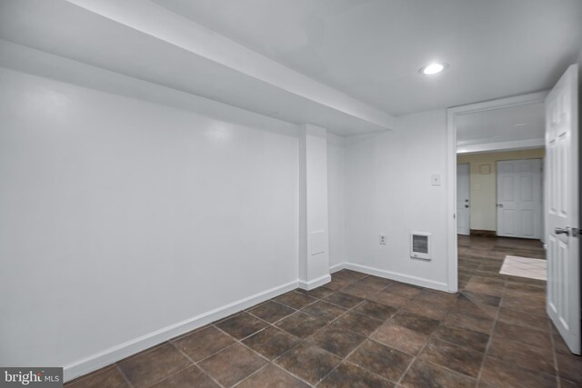 basement with dark tile patterned floors