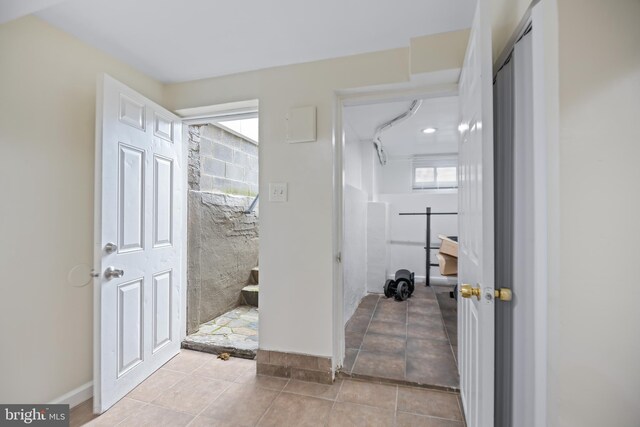 hallway with light tile patterned flooring