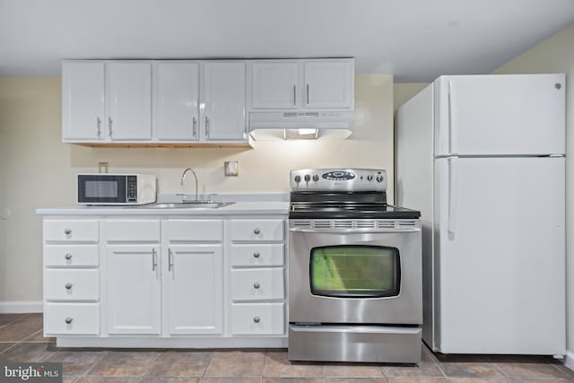 kitchen with white cabinetry, white fridge, sink, and stainless steel range with electric stovetop