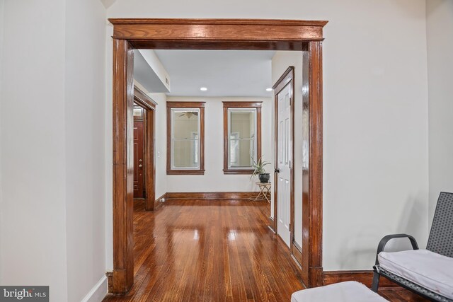 hallway with wood-type flooring