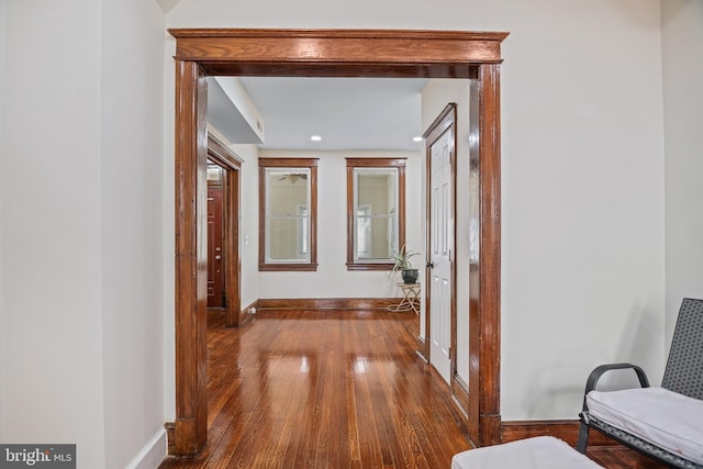 hallway featuring wood-type flooring