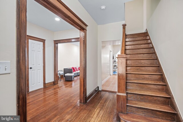 staircase featuring hardwood / wood-style floors