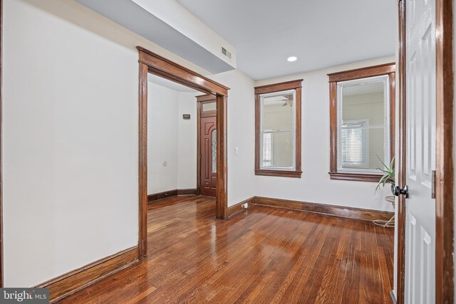 unfurnished room with wood-type flooring