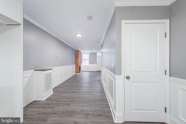 hall featuring hardwood / wood-style floors and crown molding