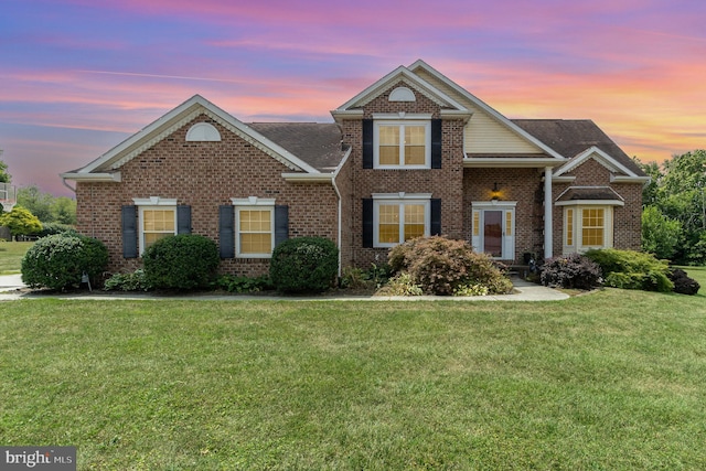 front facade with a lawn