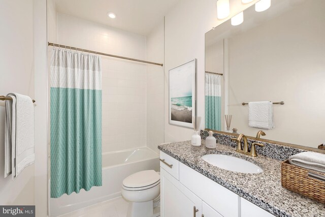 full bathroom featuring vanity, tile patterned floors, shower / tub combo, and toilet