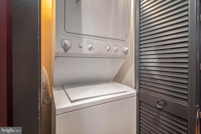 washroom with stacked washer and dryer